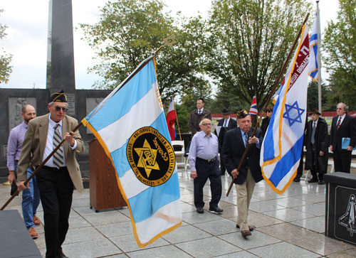 Veterans march out of the memorial